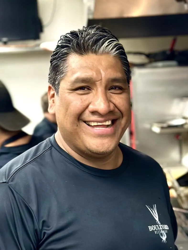 Smiling member of the kitchen team