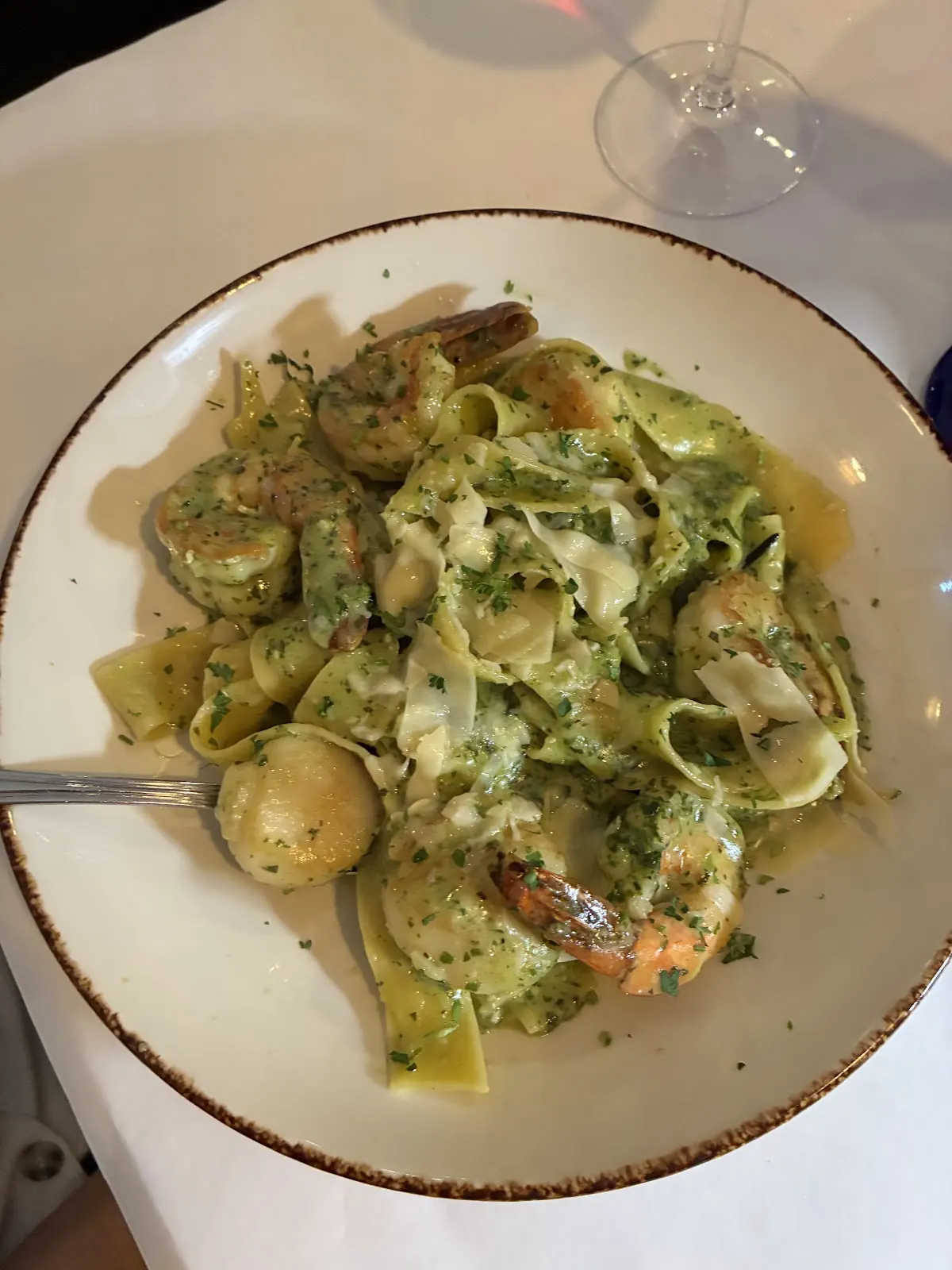 Pasta in a creamy pesto sauce with shrimp and scallops